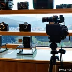 Home 21 촬영 장비 렌탈 팁과 주의사항 - A professional photography rental shop interior in a bustling Italian city, showcasing a wide array ...